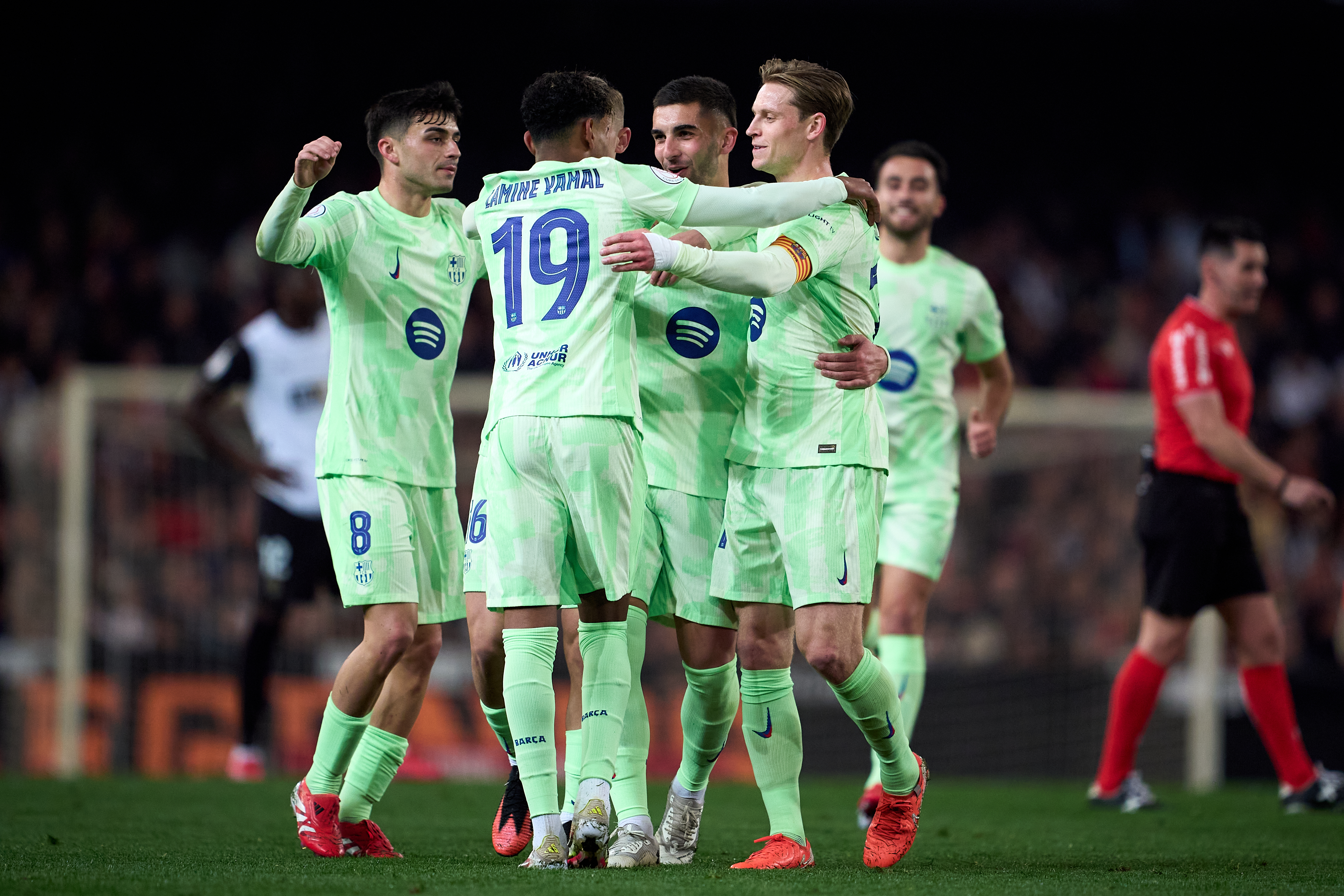 Barcelona players celebrate a Ferran Torres goal against Valencia in the Copa del Rey in February 2025.