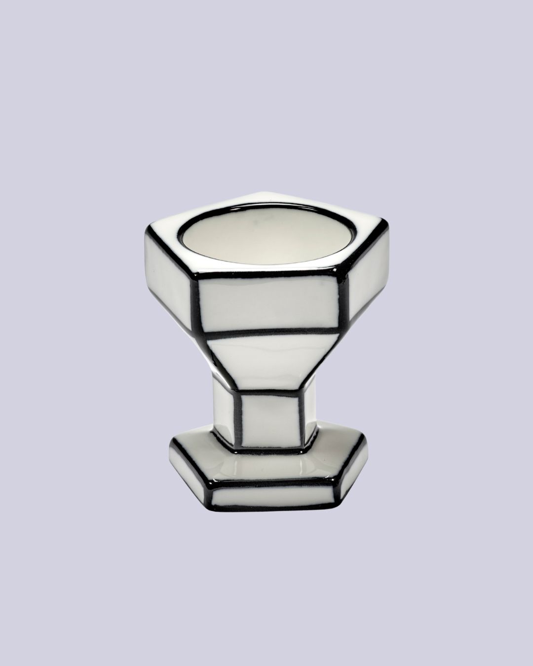 Annebet Philips Carte Blanche Porcelain Egg Cup against pale lilac background.