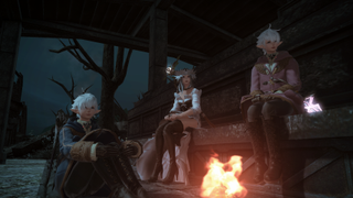 Alphinaud, the Warrior of Light and Alisaie sit around a campfire in Final Fantasy 14: Endwalker.