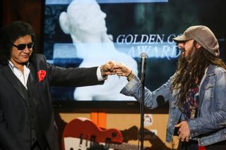 Gene Simmons presents the 'Golden God' award to Rob Zombie at the Revolver Golden Gods award show in Los Angeles in 2013