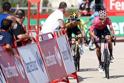 Primož Roglič trying to catch Magnus Cort of stage six of the Vuelta a España 2021