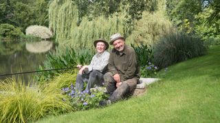 Bob Mortimer and Paul Whitehouse sit on a riverbank with fishing poles