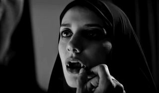 A Girl Walks Home Alone at Night a vampire's fangs are examined