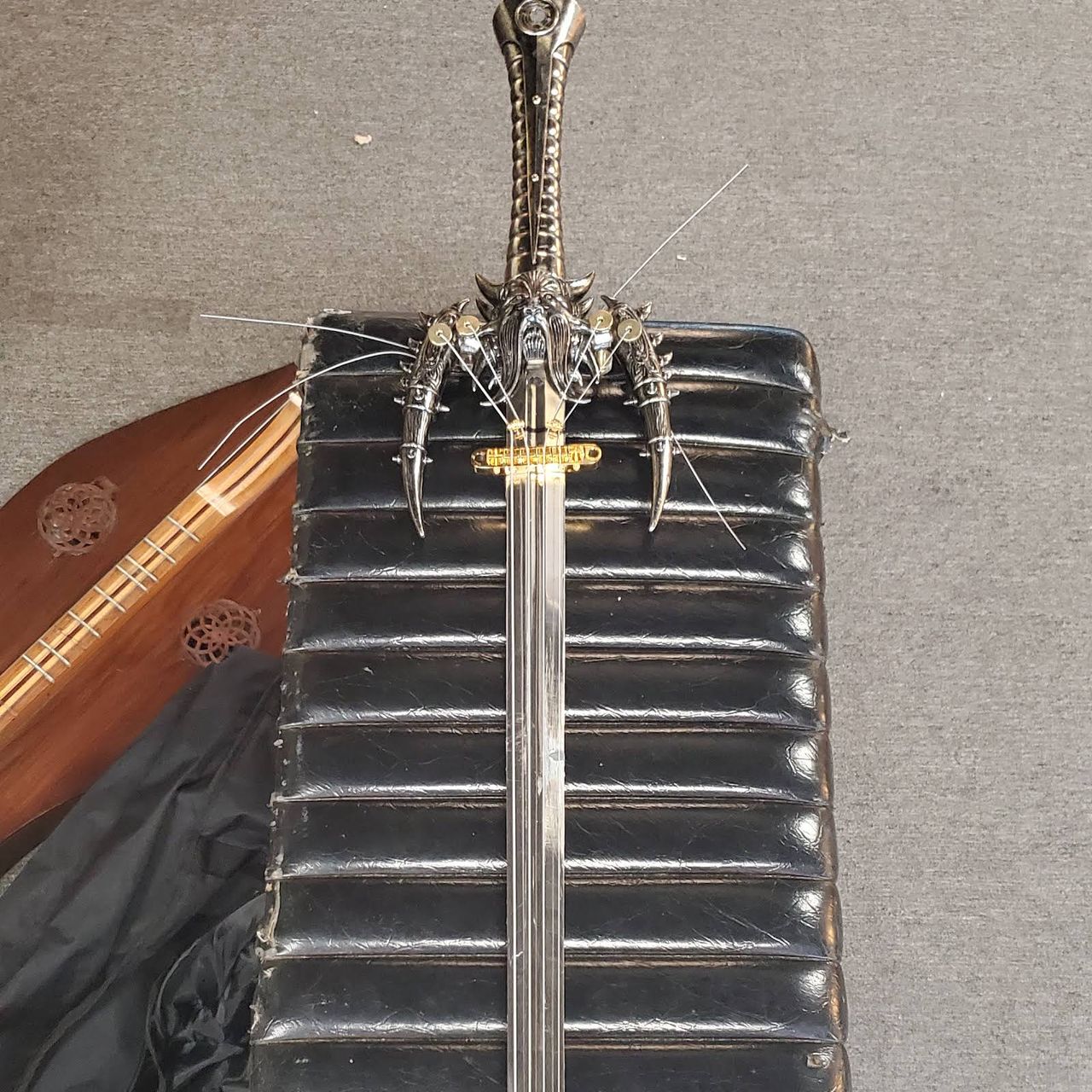 A guitar being built out of a sword