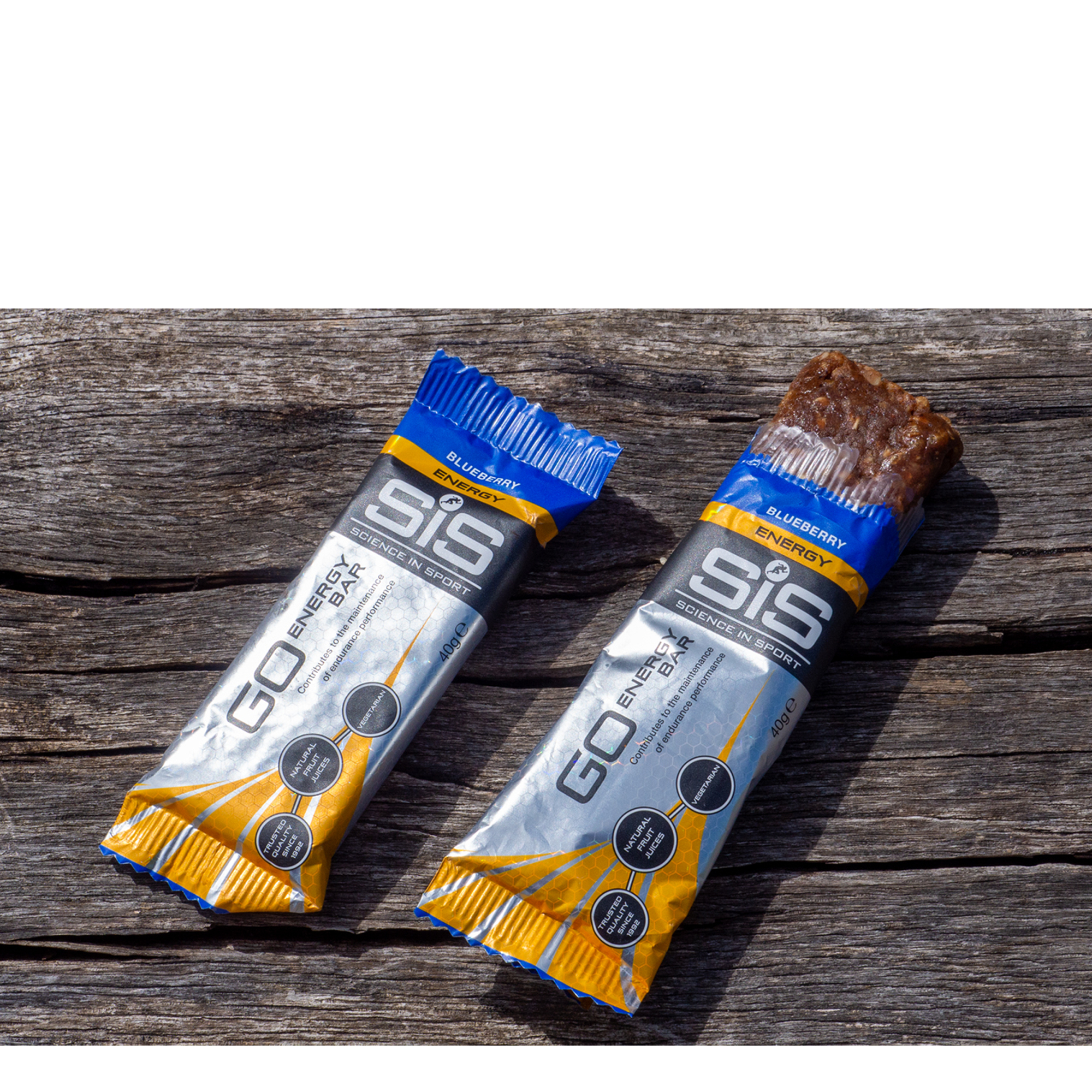 A pair of SIS energy bars on a wooden bench