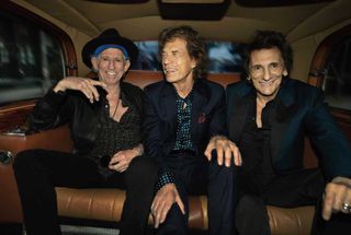 The Rolling Stones in the back seat of a car