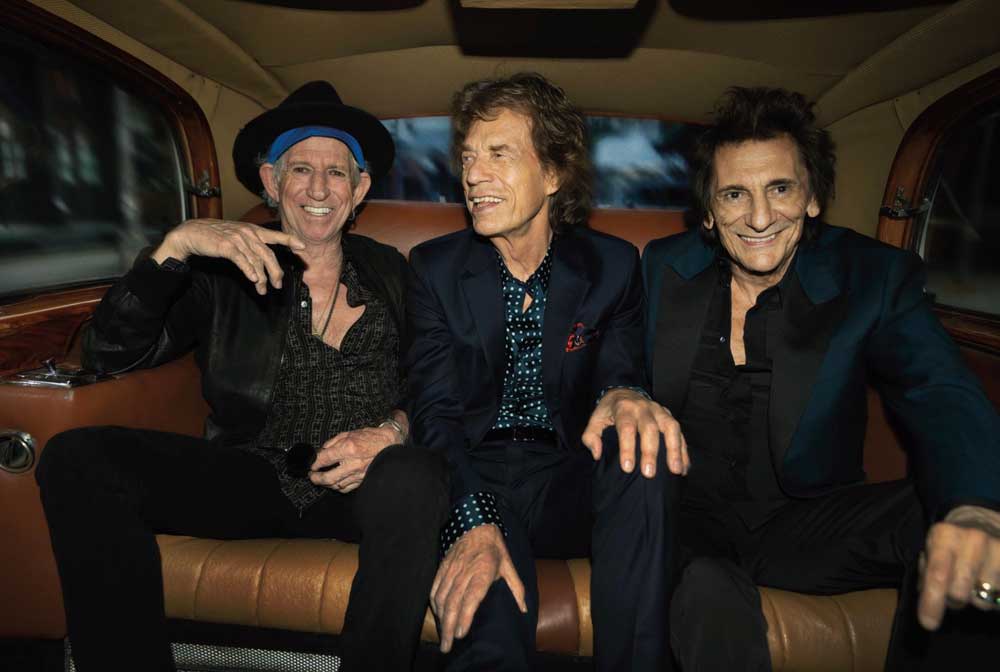 The Rolling Stones in the back seat of a car
