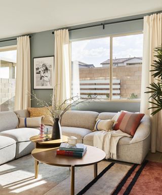 A bright neutral living room with pops of color