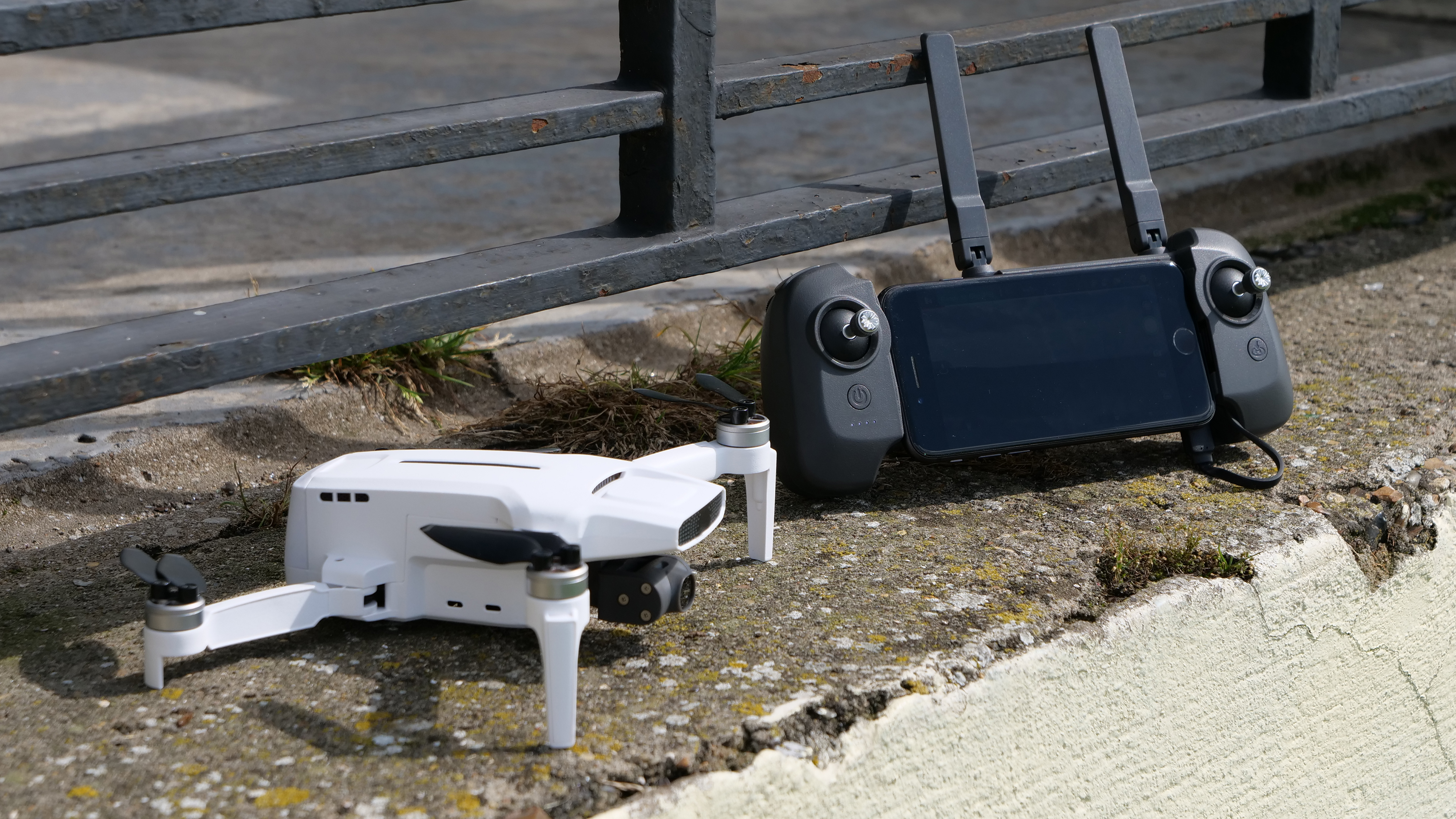 The FIMI X8 Mini drone next to its controller