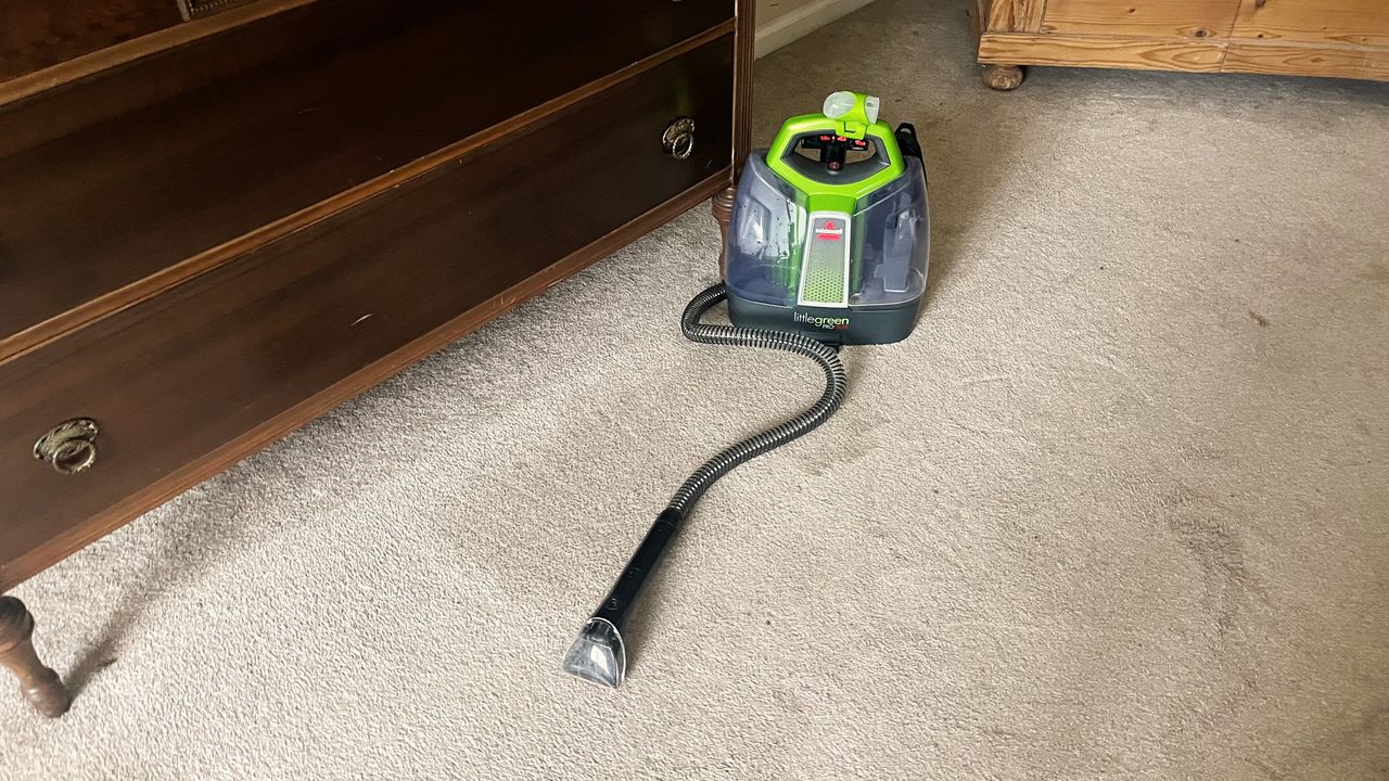 Bissell Little Green ProHeat Portable Carpet Cleaner being tested in writer's home