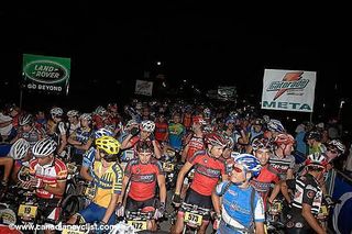Riders await the 5.15 am start for last year's race.