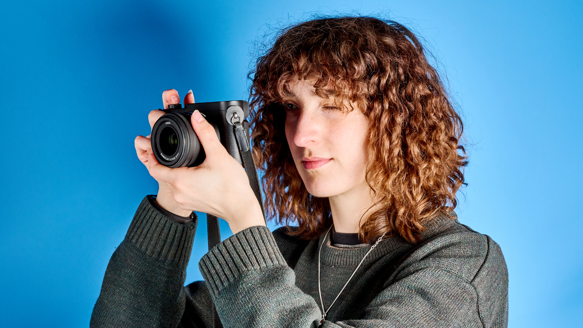 A black Leica Q3 Monochrom black-and-white mirrorless camera