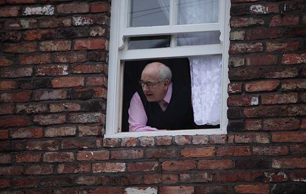 Norris Cole pokes his head out of number three Coronation Street