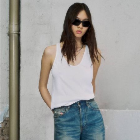 Woman wearing Diesel jeans in a street