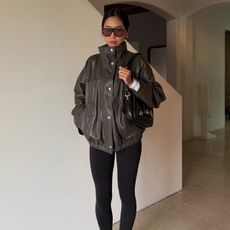 Aimee wearing a Rohe bomber jacket