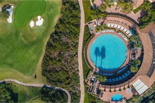 an view of pelican hill from above, the pool and gold grounds