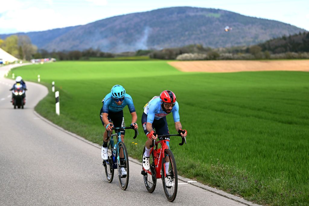 LA CHAUXDEFONDS SWITZERLAND APRIL 27 LR Gleb Brussenskiy of Kazakhstan and Astana Qazaqstan Team and Julien Bernard of France and Team TrekSegafredo Blue mountain jersey compete in the breakaway during the 76th Tour De Romandie 2023 Stage 2 a 1627km stage from Morteau to La ChauxdeFonds UCIWT on April 27 2023 in La ChauxdeFonds Switzerland Photo by Dario BelingheriGetty Images