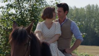 Elizabeth and Nathan riding on a horse in Season 13 of When Calls the Heart.