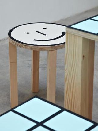 The illustrator and art director has composed the ’Table Man’ from a table, benches and a stool