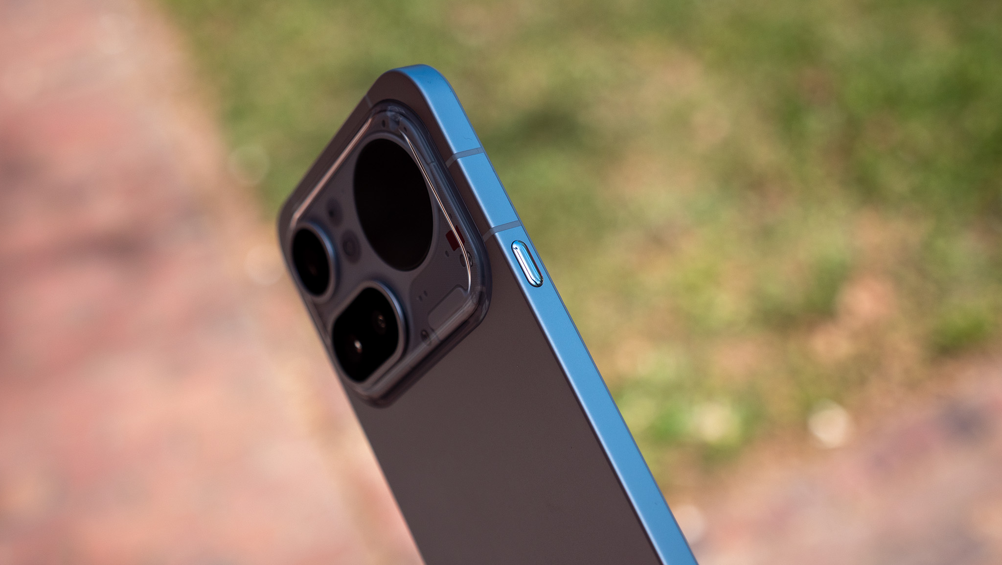 A close-up look at the buttons, ports, and camera lenses on the Nothing Phone 4a Pro