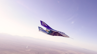 a white and purple space plane soars through the air with mountains in the background