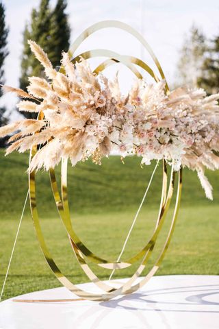 floral hoop backdrop at wedding