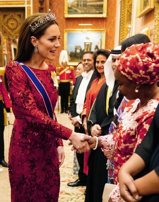 Kate Middleton shaking hands at a diplomatic reception