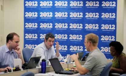 Staff are seen at President Obama's re-election campaign headquarters in Chicago: The president employs twice as many employees as Mitt Romney's campaign.