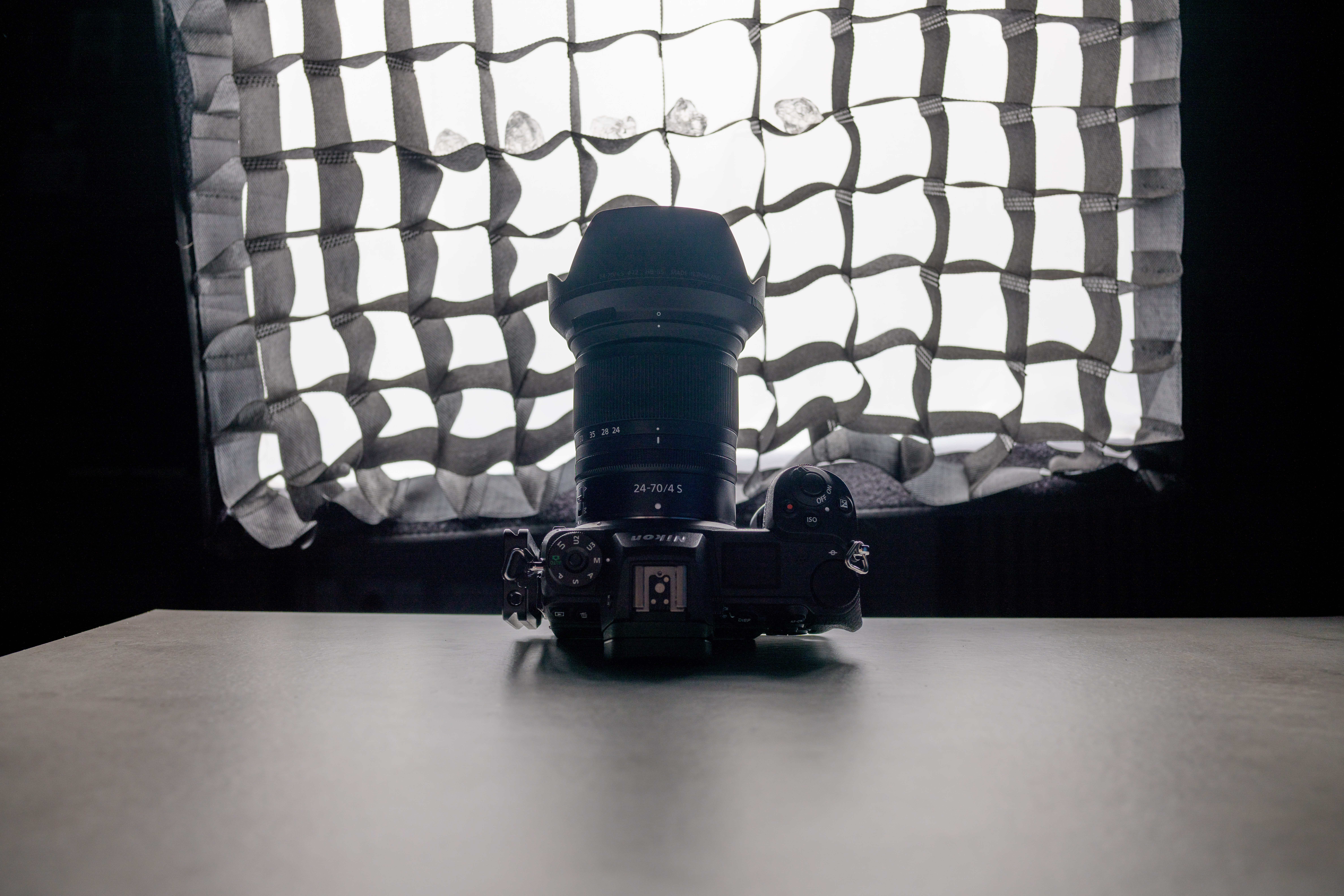 A photo of a camera in front of a softbox