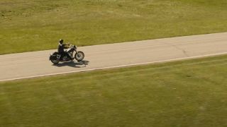 A motorcycle on the open road, shot from above