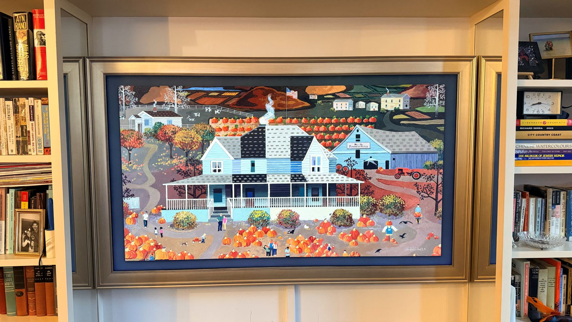 Samsung The Frame showing image of house decorated for Halloween
