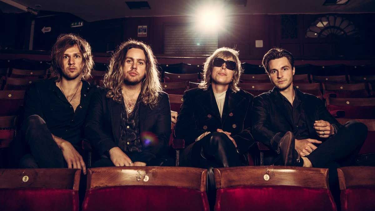 The Struts in a row of cinema seats