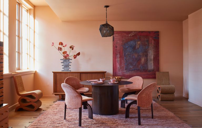 an orange-pink living room with a painted ceiling
