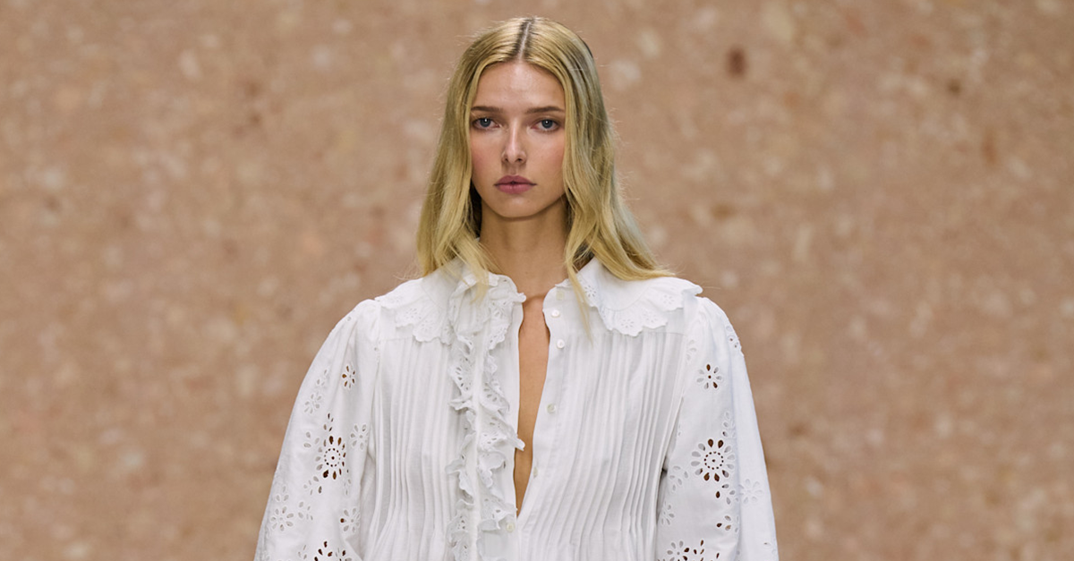 Apple Martin walking the Chloé runway in a white dress