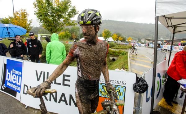 Alban Lakata (Austria) finishes up, covered in mud