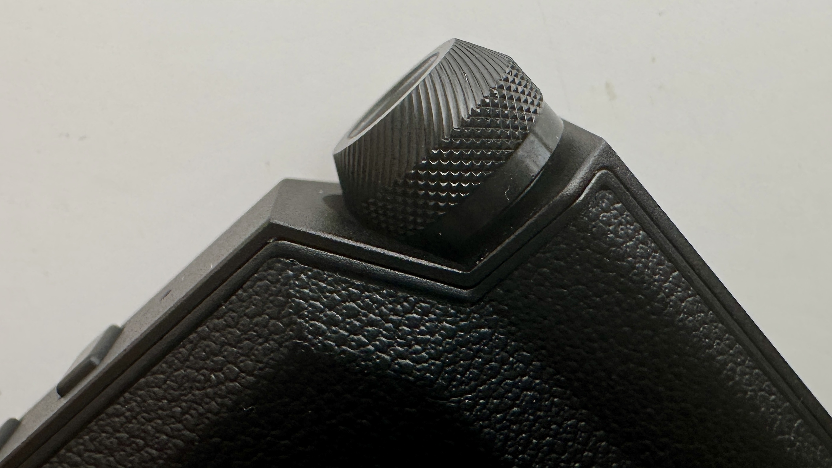 FiiO's BTR17 DAC/amp in black, on a gray table, showing PCM resolution in yellow font