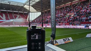 A Wisycom wireless solution sits at the cusp of a soccer pitch ready for action.