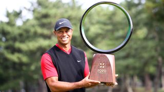 Tiger Woods of the United States poses with the trophy after the award ceremony following the final round of the Zozo Championship
