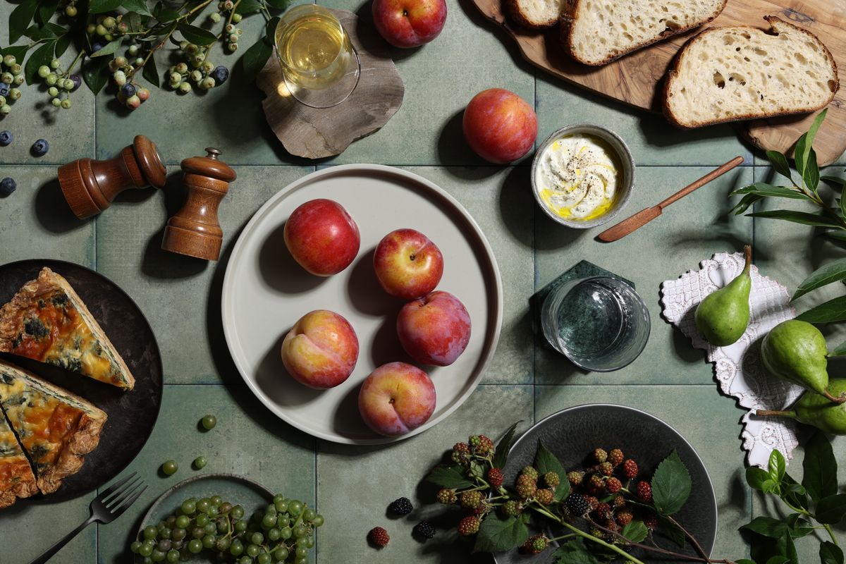 Canon RF 45mm F1.2 STM sample images: a flat lay of a food platter including fruit, bread and dips