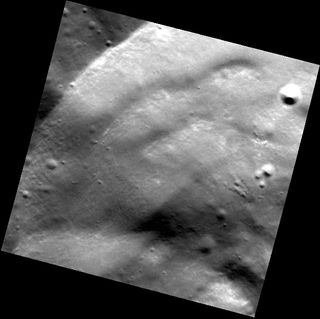 This high-resolution image, taken on May 21, 2011, of a crater wall shows several slumps that occurred after the 20-km-diameter crater formed. The bottom-right corner of this image is located inside of the crater, and the upper-left corner is located outs