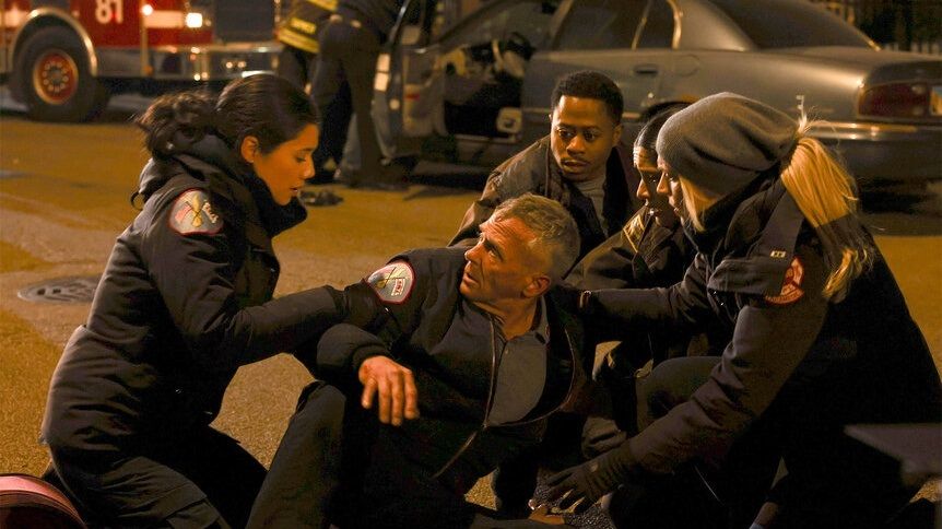 Violet Mikami (Hanako Greensmith) aiding Christopher Herrmann (David Eigenberg) on Chicago Fire Season 12 Episode 1 &quot;Barely Gone&quot;