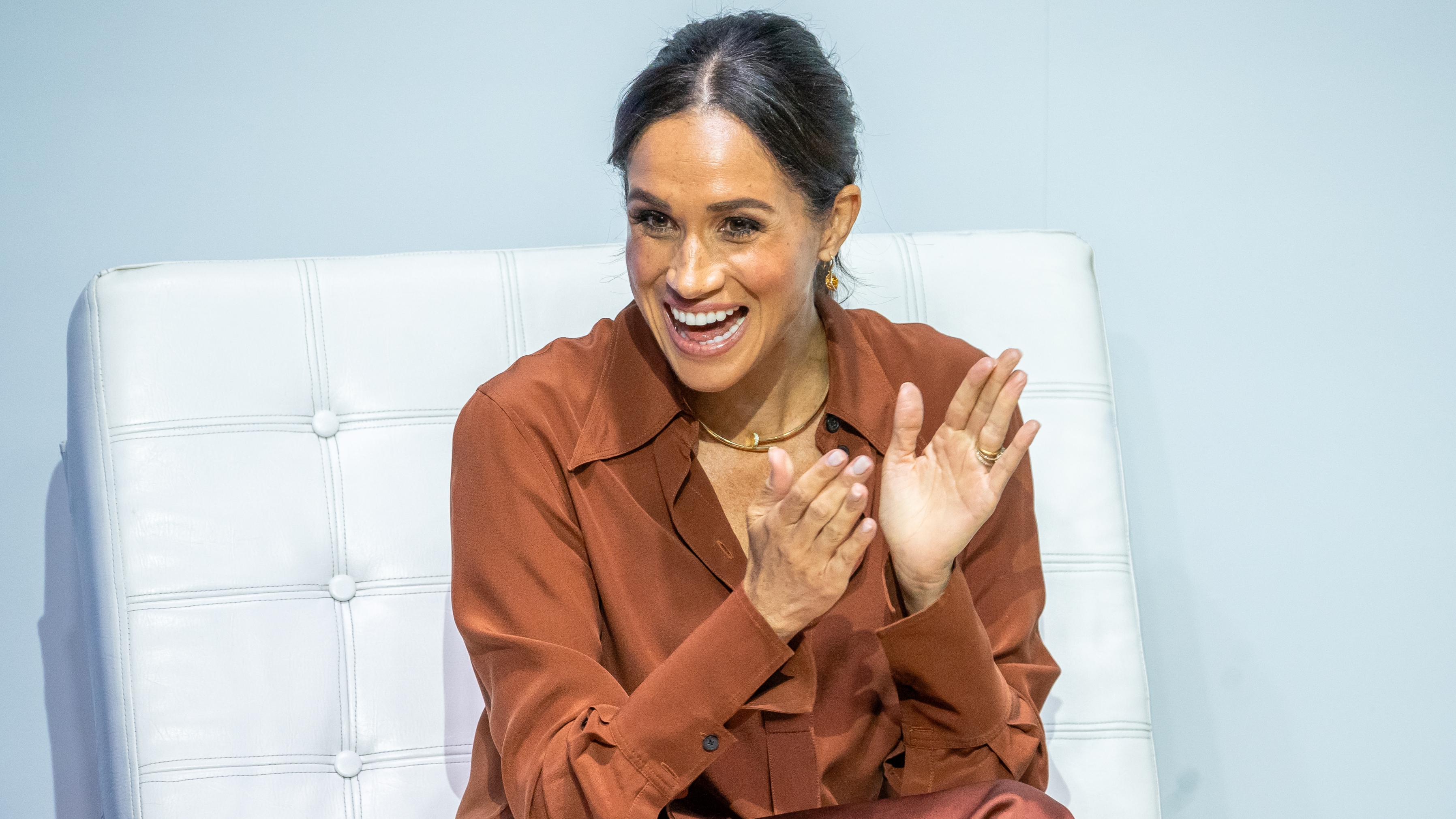 Meghan, Duchess of Sussex, reacts during a forum about digital responsibility at EAN University during a visit around Colombia on August 15, 2024