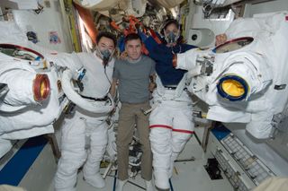 Crew Members Pose for Photo in Airlock