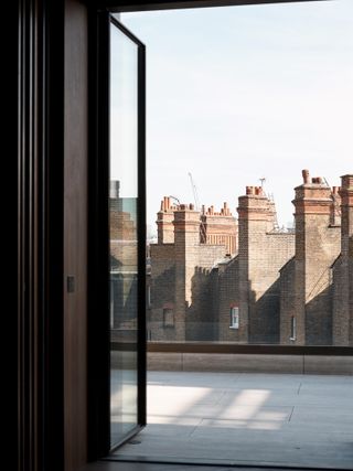 Window overlooking Mayfair buildings