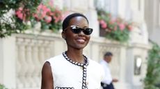 Lupita Nyong'o wearing a monochrome chanel boucle tweed outfit