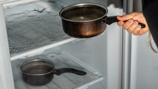 pans of hot water use to speed up defrosting a freezer