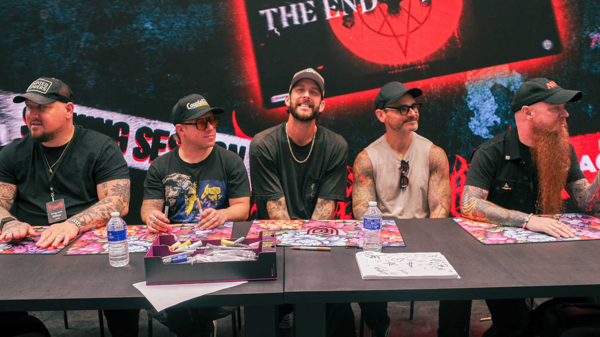 Atreyu hosting an Ultimate Guard signing session at Magic Con