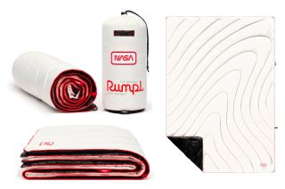 Rumpl's NASA White & Red original puffy blanket, part of the company's limited edition Artemis collection, utilizes the iconic NASA "worm."