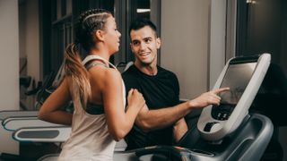 Coach showing runner options on treadmill