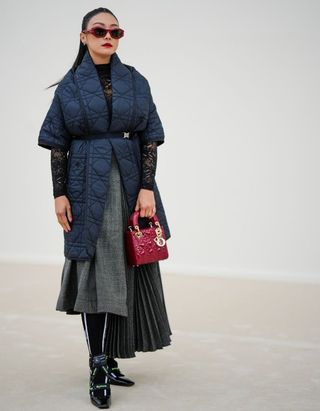 Paris Fashion Week woman wearing quilted coat